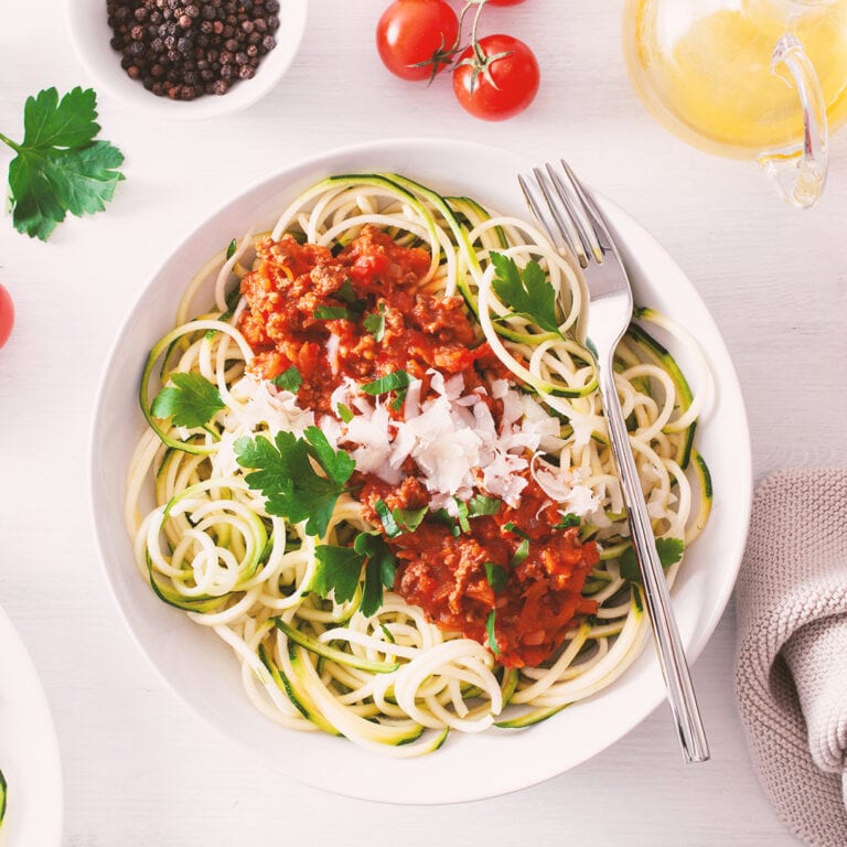 Keto paleo zoodles bolognese: zucchini noodles with meat sauce a